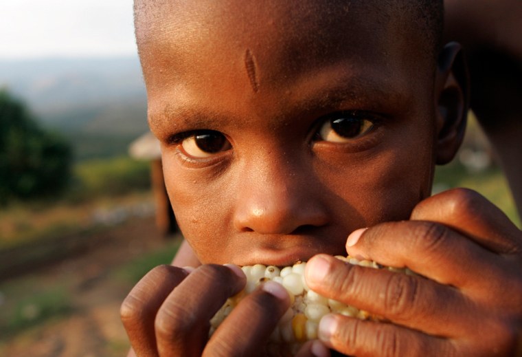 Image: A little boy showing tribal scars on his face