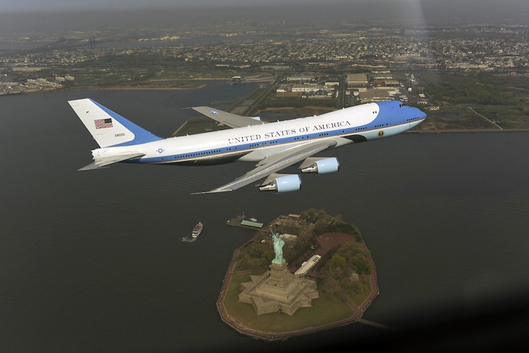 Image: In this photograph released by the White House, one of the president's official planes flies over the Statue of Liberty in New York