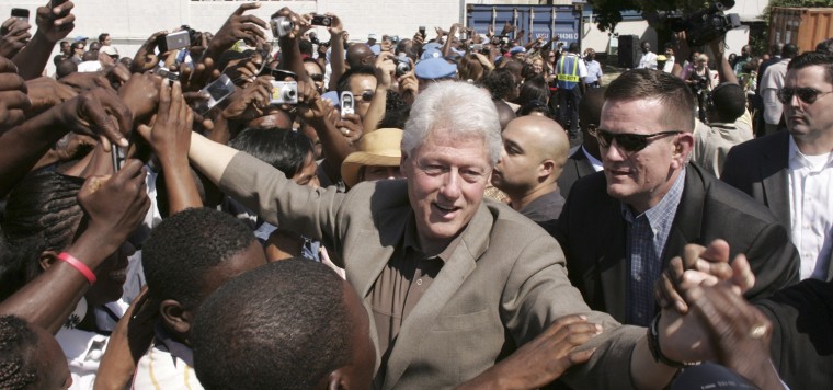 Image: Former U.S. President Clinton greets Haitians