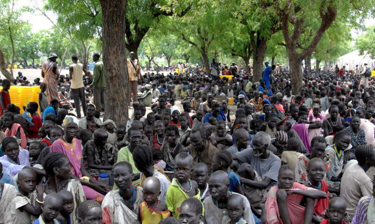 Image: People displaced by violence wait for supplies in southern Sudan