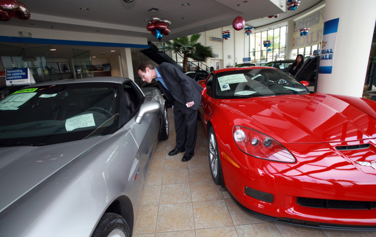 Image: Steve Fischer of Los Angeles contemplates the purchase of a new Chevrolet Corvette