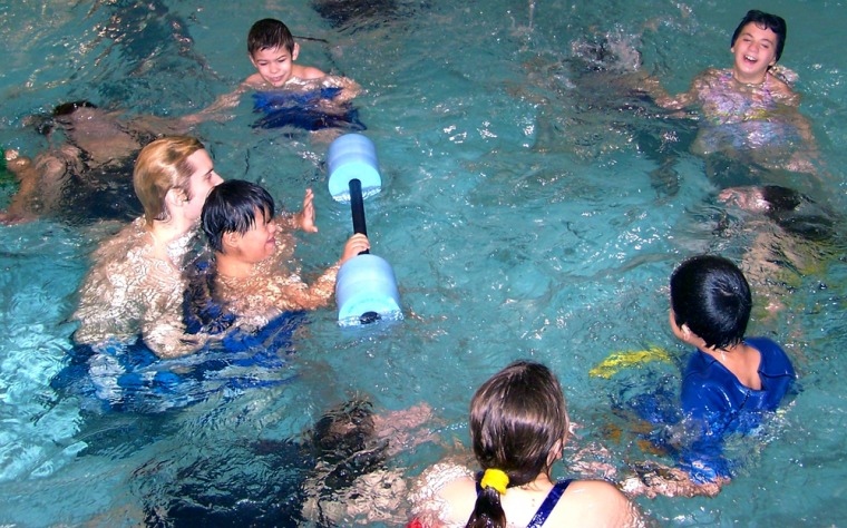 Instructors teach special needs kids how to hold their breath under water during a water safety class at the Elkhart YMCA. The class, funded by The United Way, is part of a 3o-year-old program that is a risk of ending becuase The United Way can no longer afford to fund it.