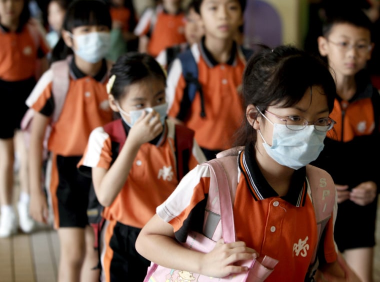 Image: Students leave school in Hong Kong