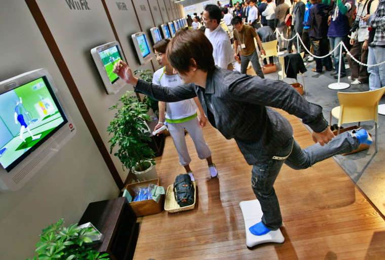 Image: A model demonstrates Nintendo Co.'s game \"Wii Fit\"