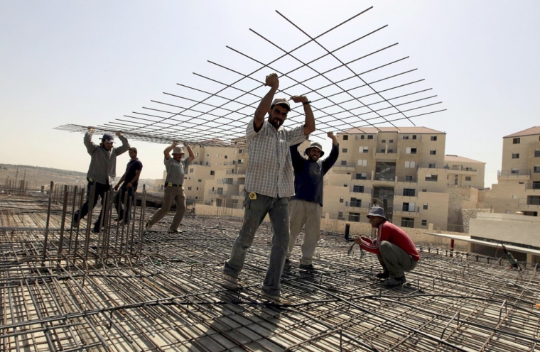 Image: Arab workers in the Beitar Illit settlement in southern West Bank