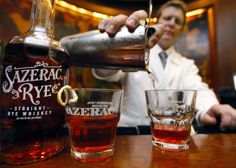 Image: a bartender perpares a cocktail