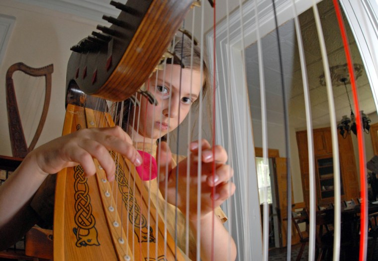 Image: Ada Graham Lowengard practices the harp