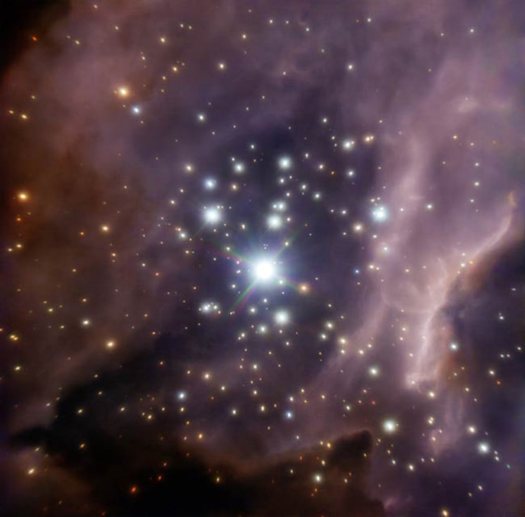 The central part of the stellar cluster RCW 38, around the young, massive star system IRS2, is seen in a color composite image.