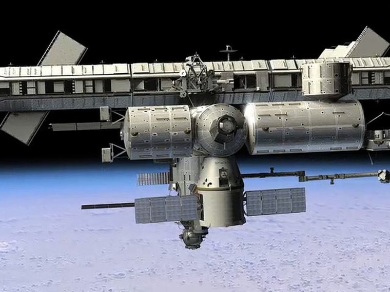 Image: An artist's interpretation of a SpaceX Dragon cargo ship docked at the International Space Station.