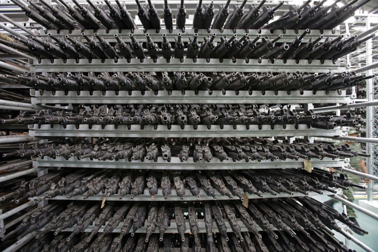 Image: Seized weapons sit on racks in a seized weapons warehouse in Mexico City.