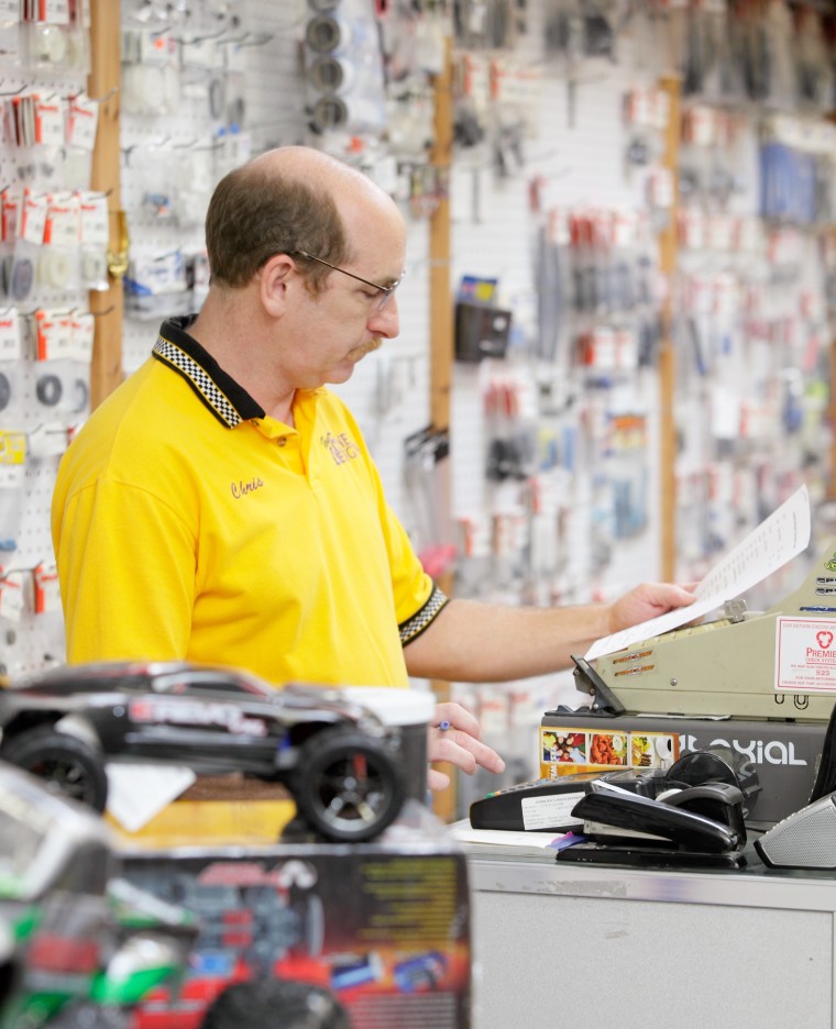 Image: Chris Fine works at the cash register at Mid-Hudson Hobbies