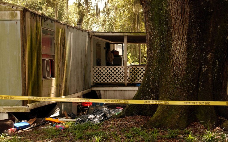 Image: The house at New Hope Mobile Home Park in Brunswick, Ga where seven people were found slain