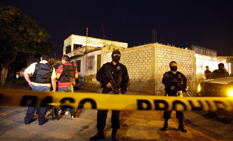 Image: Police guard the scene where 17 were killed in Mexico