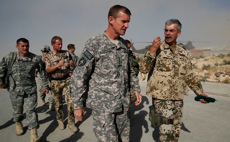 Image: U.S Gen. Stanley McChrystal, center, is welcomed by German Brigadier General Joerg Vollme, right