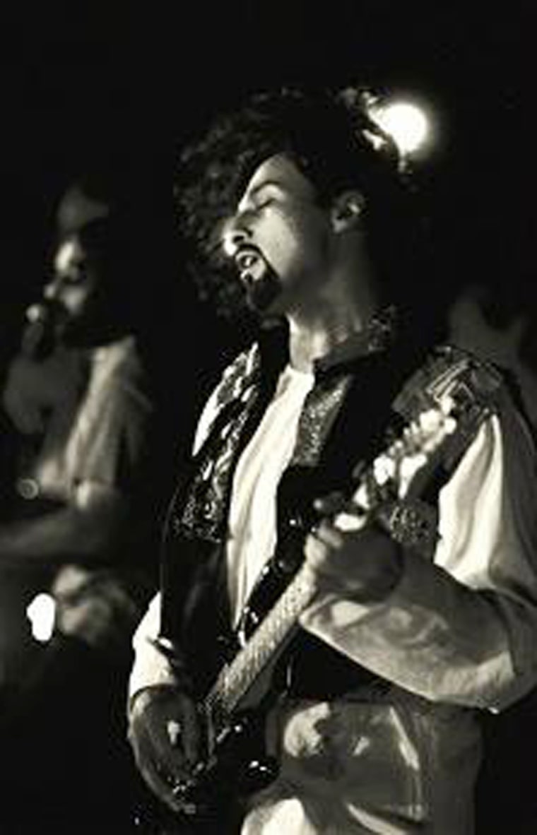 Salman Ahmad plays guitar with his rock band Junoon.