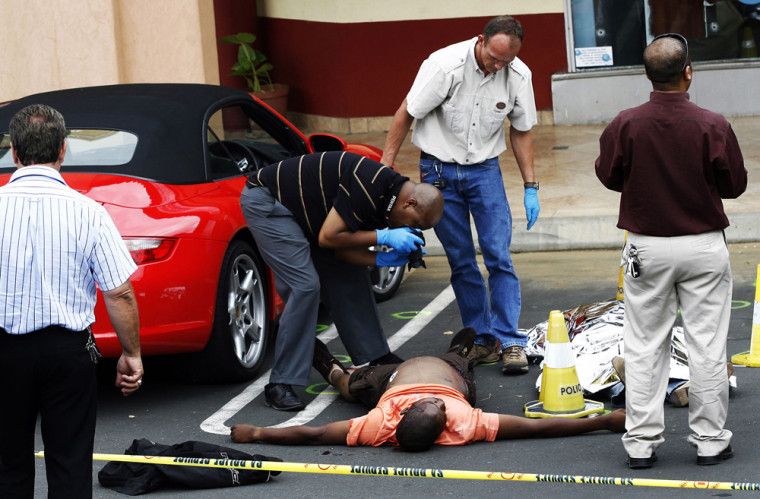 Image: Police investigate the crime scene