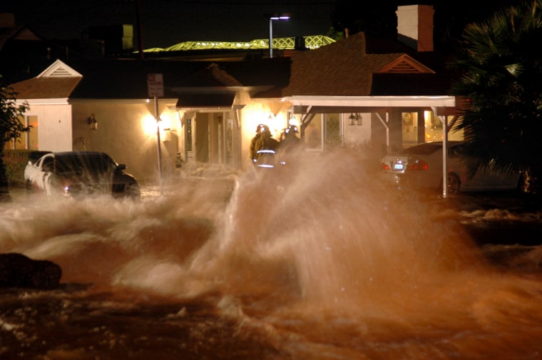 Image: water gushes from a broken water main in L.A.