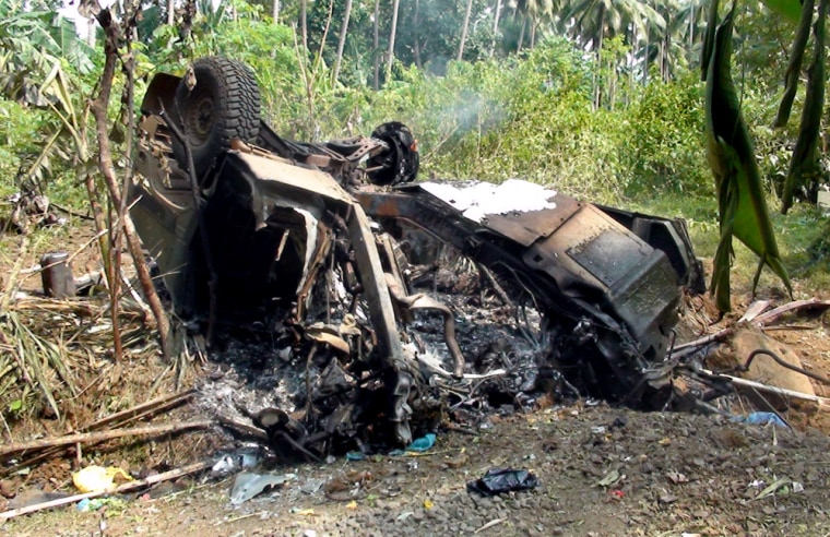 Image: a smoldering humvee remains after two U.S. soldiers were killed