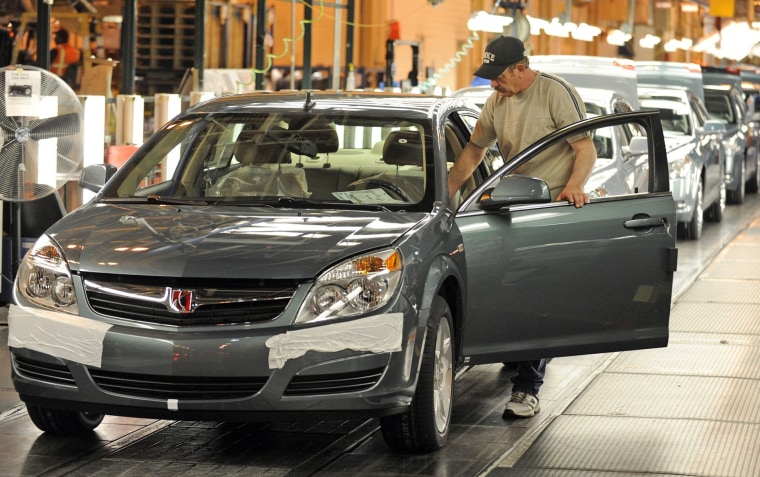Image: File photo of Harrison preparing to drive a Saturn Aura from the assembly line to its final inspection at the General Motors Fairfax Assembly Plant in Kansas City