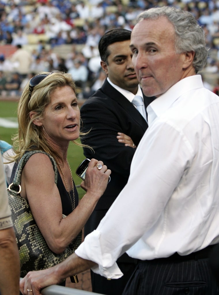 Image: Dodgers owner Frank McCourt and wife Jamie McCourt are seen in the stands before play begins between the Dodgers and the Phillies in Los Angeles