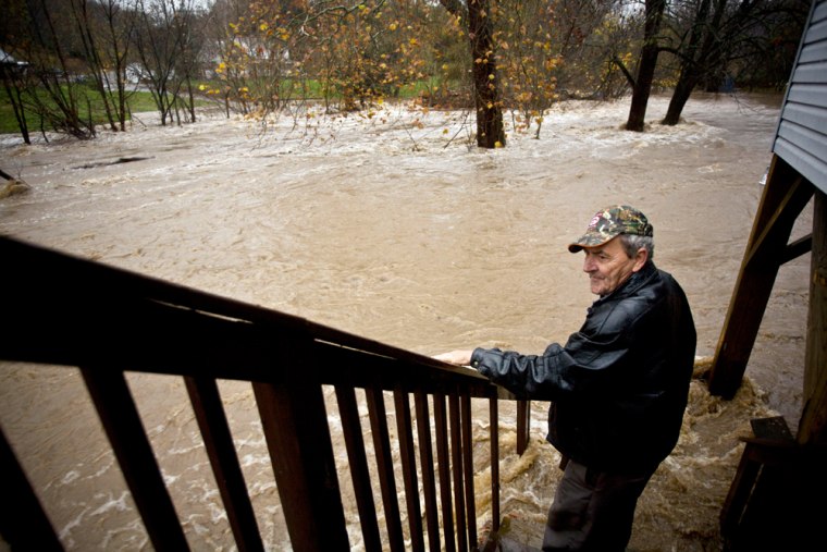 Image: Man looking at flood