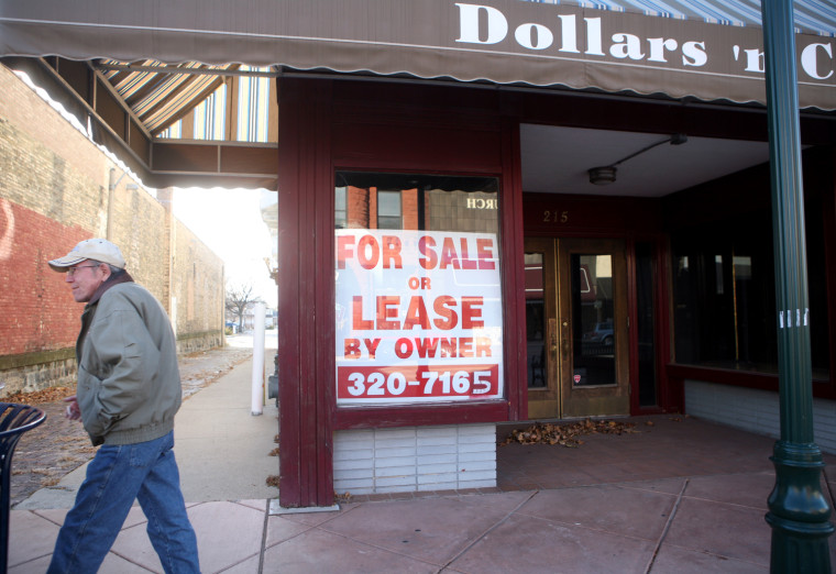 Image: Dilapidated, abandoned & boarded up store fronts in Elkhart IN. The store front formerly \"Dollars 'n Cents\" on Main St. in downtown Elkhart Indiana, stands empty on Wednesday, Nov.11,2009.