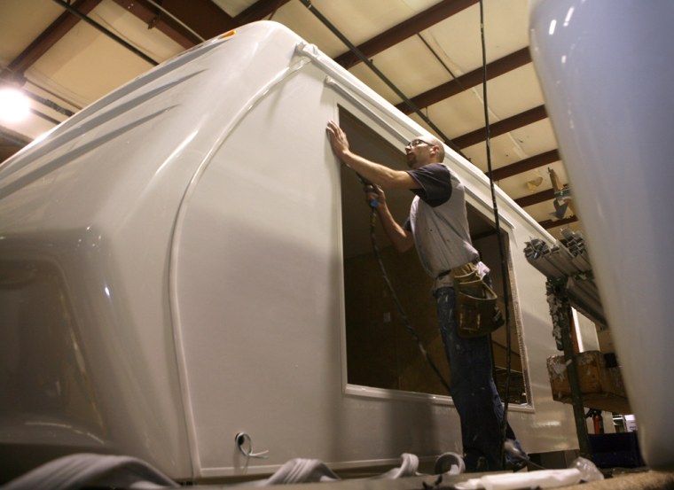 Image: Rick Williams works on an RV at Jayco Industries, and Elkhart Recreational Vehicle manufacturer