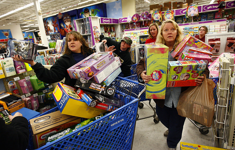 Image: Eager Retailers Greet Crowds Of Shoppers On \"Black Friday\"