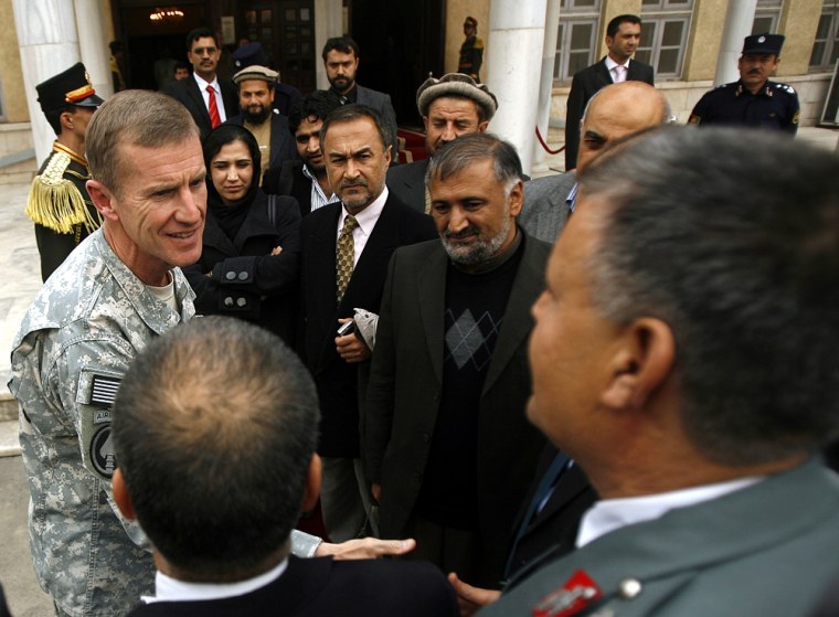 Image: General Stanley McChrystal greets Afghan parliament members in Kabul, Afghanistan