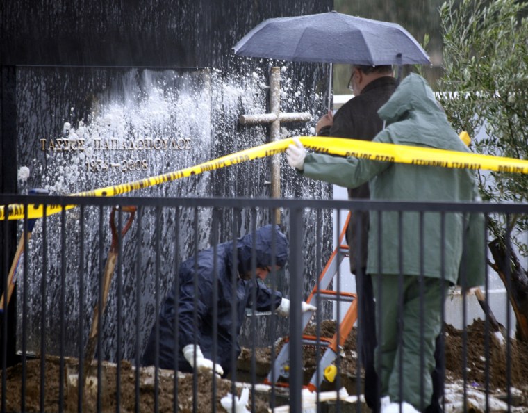 Image: Police investigate near the grave of former Cyprus President Tassos Papadopoulos