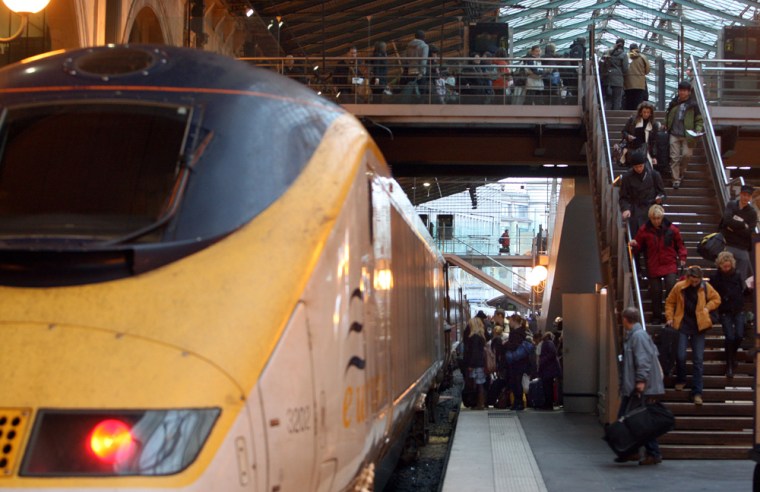 Image: Passengers board a Eurostar train at the Gare du Nord station in Paris