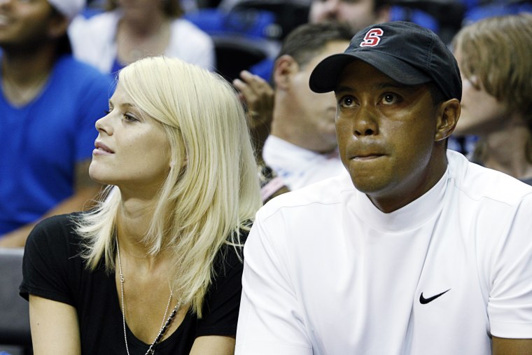 Image: Tiger Woods and his wife Elin Nordegren watch Game 4 of the NBA Finals basketball game in Orlando