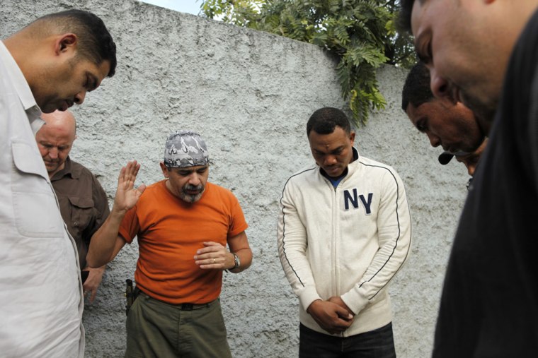 Image: Life Church members pray before drive to Haiti