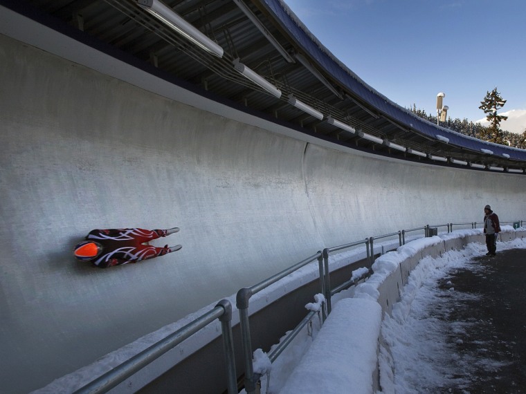 Image: Gough of Canada takes part in a men's luge training run at the Olympic Sliding Centre in Whistler
