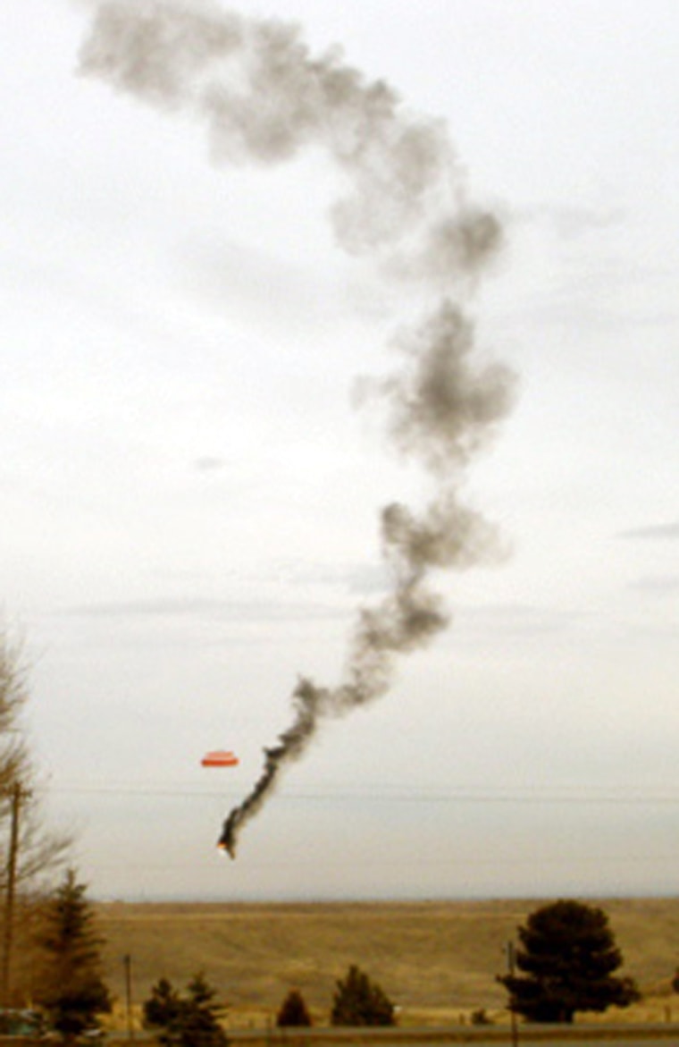 Image: A burning aircraft falls to the ground Saturday