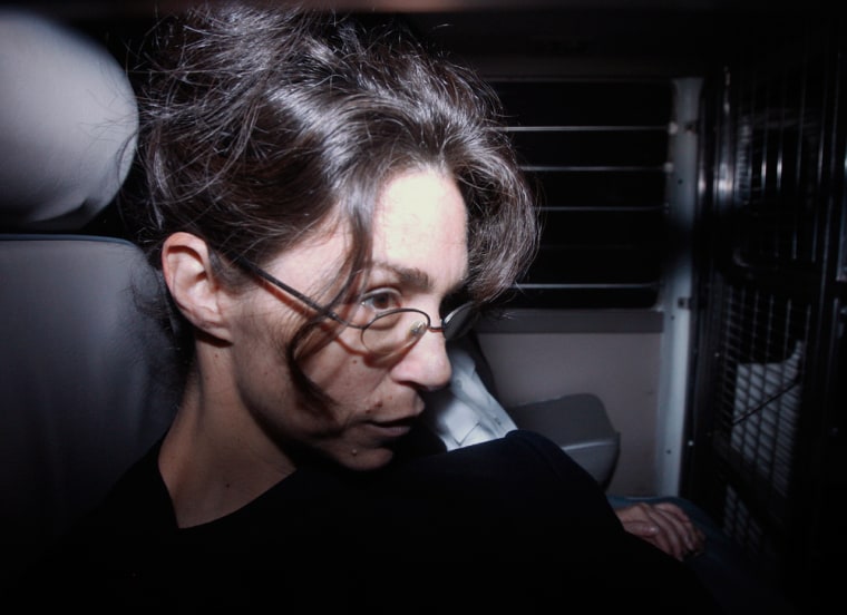Image: Nancy Kissel, dubbed the \"milkshake\" murderess, sits in a prison van as she arrives at the Court of Final Appeal in Hong Kong