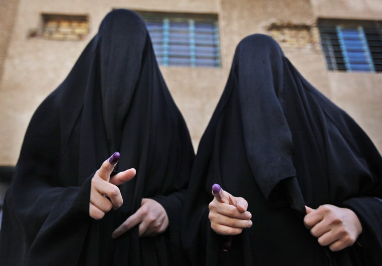 Image: Two Iraqi women display their inked fingers