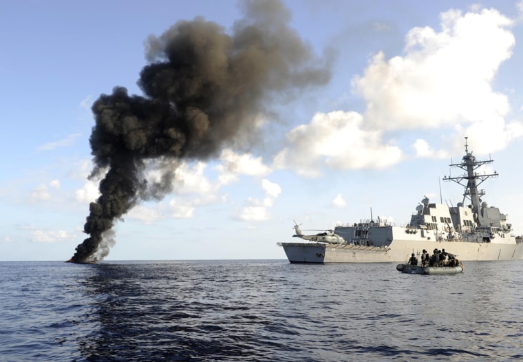 Image: Pirate skiff burns next to the USS Farragut