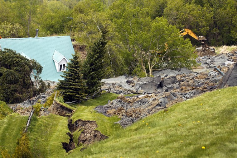 Image: A house is seen after it was destroyed by a landslide in Saint-Jude