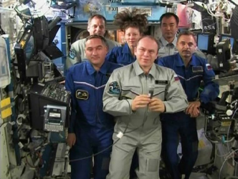 Image: Members of the Expedition 23 crew talk with Russian President Dmitry Medvedev from the International Space Station