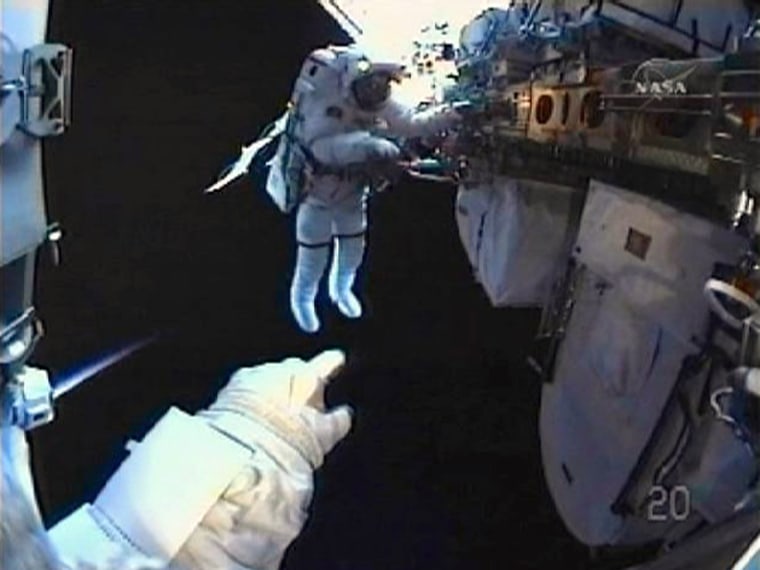 Image: Space Shuttle Discovery astronaut Rick Mastracchio works in this view from Clayton Anderson's helmet camera