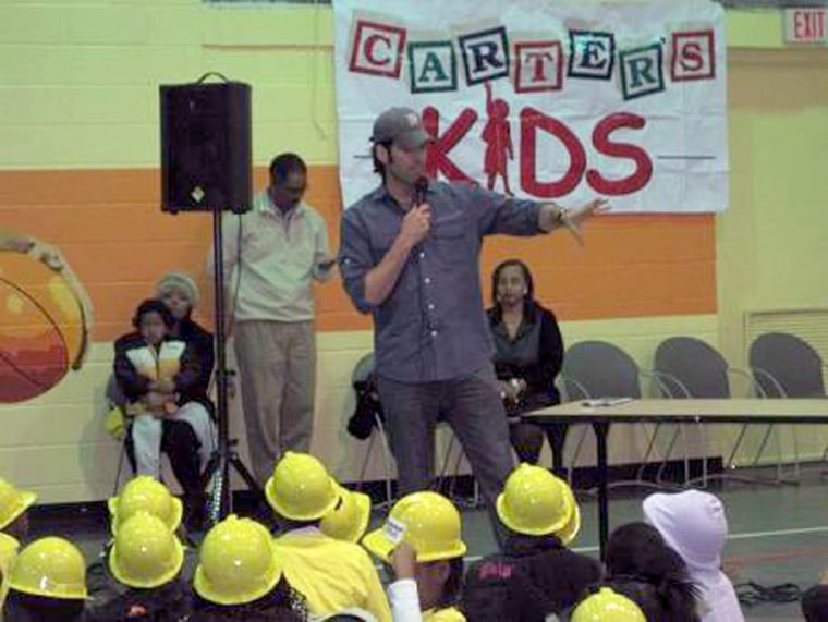 Carter Oosterhouse addresses some of the children in his Carter’s Kids at an event. 