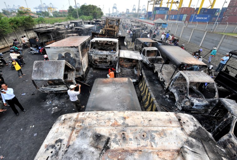 Image: Burned cars in Jakarta following clashes between protesters and members of the security forces