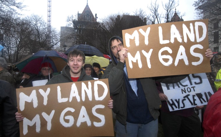 Image: Alex Knapp and his father Albert Knapp protest in favor of the drilling process for hydraulic fracturing at the Capitol in Albany, New York
