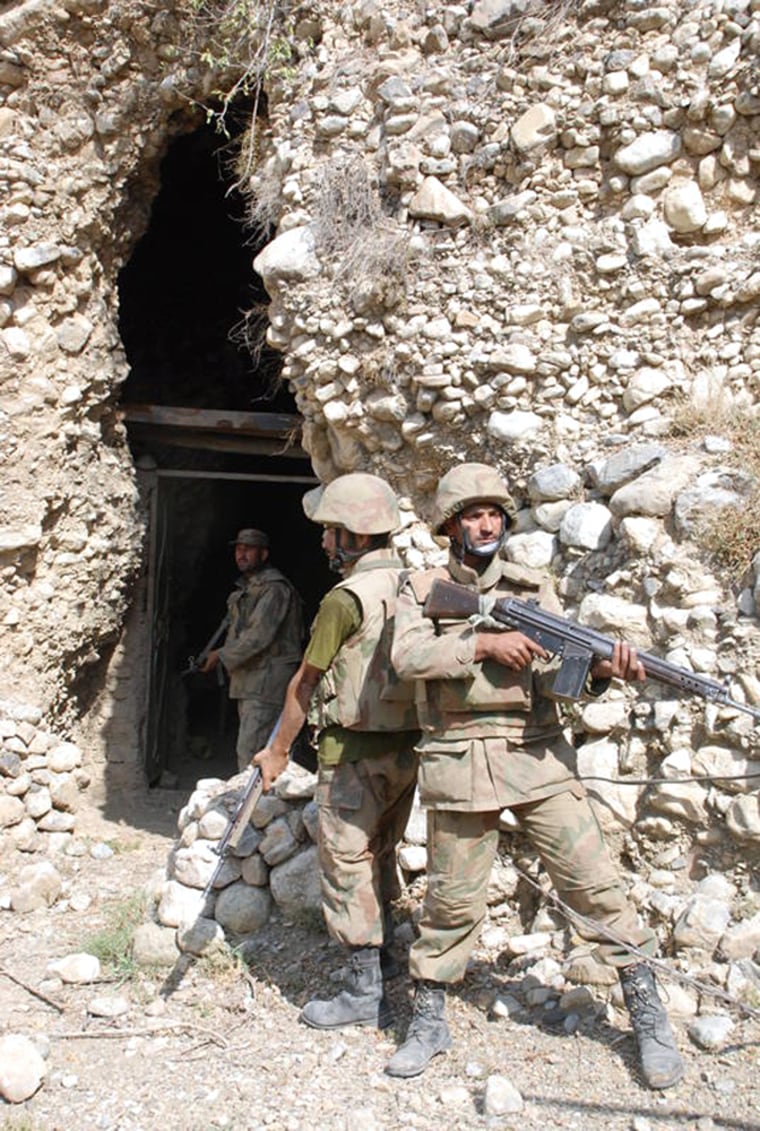 Image: Pakistan army outside of a cave allegedly used by militants in Taliban stronghold