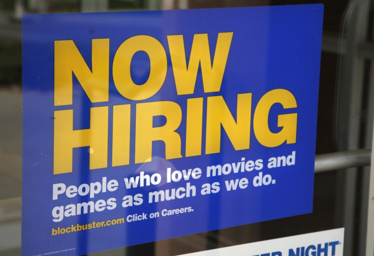 Image: A help wanted sign hangs on the door of a Blockbuster movie and game store in Golden