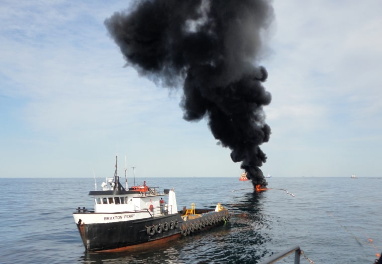 Oil is set on fire in a test burn last week in the Gulf of Mexico. The test used what is called a fire boom, basically a fireproof material that can be reused.