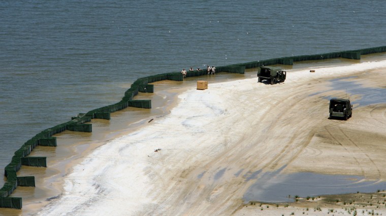 Image: Members of the U.S. Army National Guard install Hesco containers along the beaches of Dauphin Island, Ala.