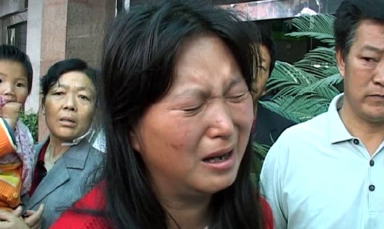 Image: A Chinese woman cries