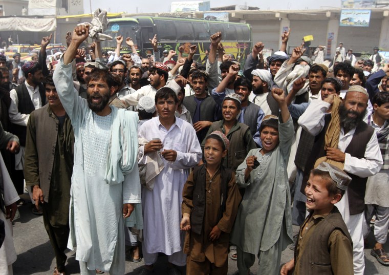 Image: Afghan protesters shout anti-American slogans during a protest rally in Kandahar